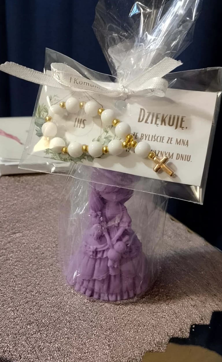 Religious thank you gift with white beaded bracelet and gold cross on card, wrapped with purple decorative base and clear cellophane