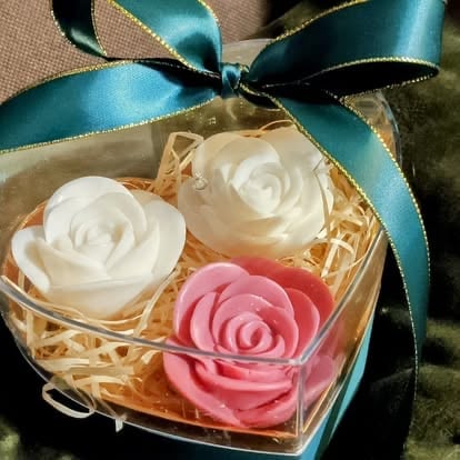 Decorative soap gift box with three rose-shaped soaps in white and pink, topped with a teal ribbon bow