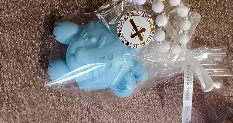 Blue airplane toy and decorative white pearls in plastic bags on beige carpet